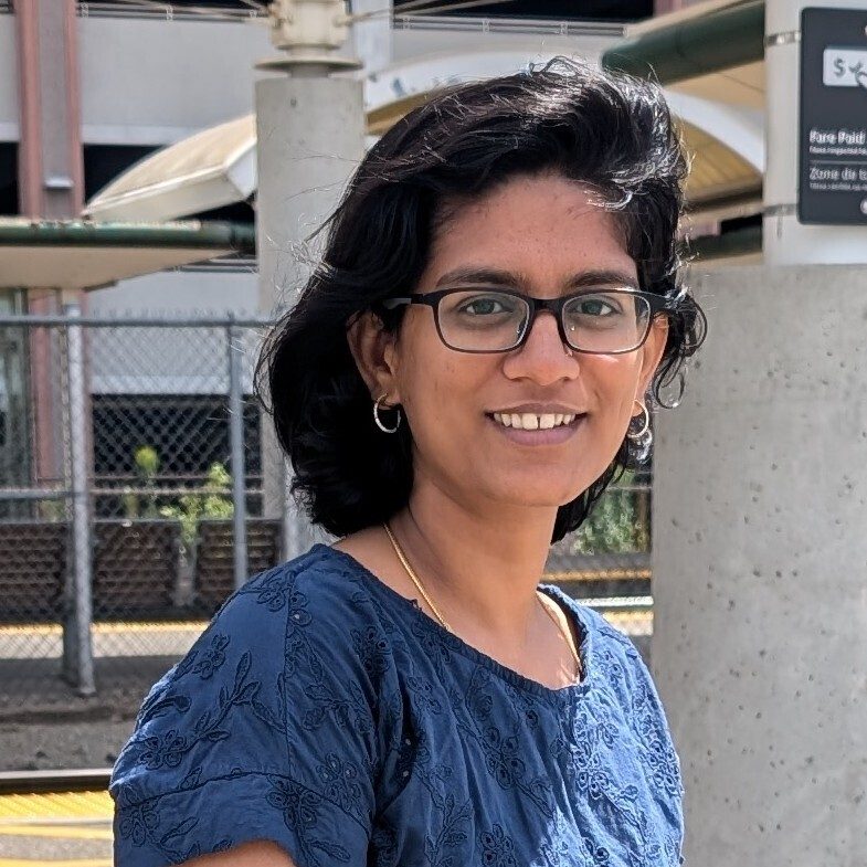A picture of Meena wearing a blue shirt