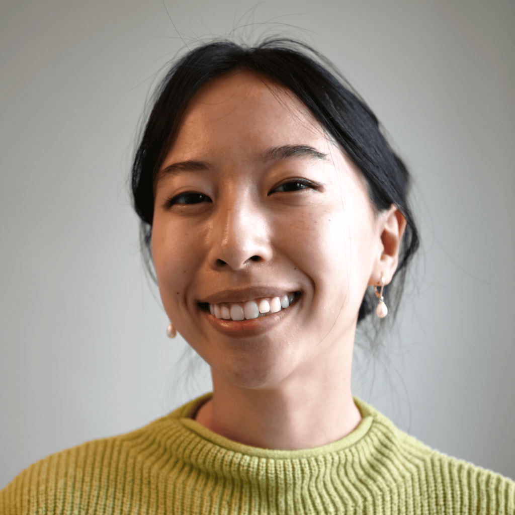 A picture of Jasmine Lu wearing a yellow shirt